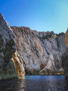 Preview wallpaper cliff, mountains, rocks, lake, sky