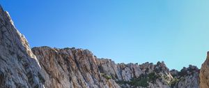 Preview wallpaper cliff, mountains, rocks, lake, sky