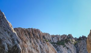 Preview wallpaper cliff, mountains, rocks, lake, sky