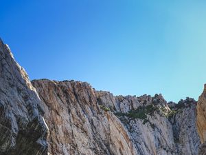 Preview wallpaper cliff, mountains, rocks, lake, sky