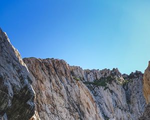 Preview wallpaper cliff, mountains, rocks, lake, sky