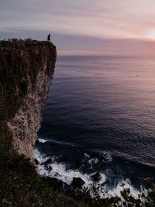 Preview wallpaper cliff, person, alone, sea, shore