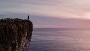 Preview wallpaper cliff, person, alone, sea, shore