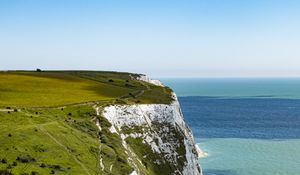 Preview wallpaper cliff, rock, coast, grass, sea