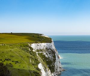 Preview wallpaper cliff, rock, coast, grass, sea