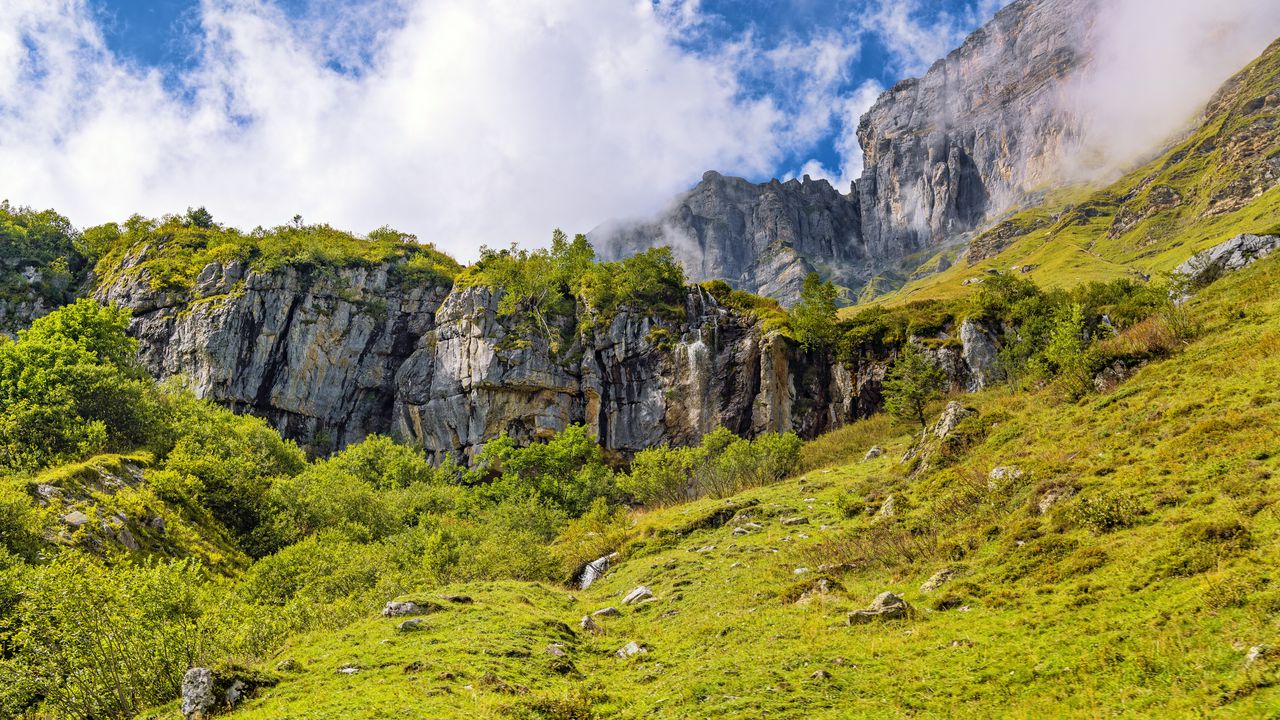 Wallpaper cliff, rock, grass, clouds
