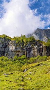 Preview wallpaper cliff, rock, grass, clouds