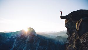 Preview wallpaper cliff, rock, man, mountains, height