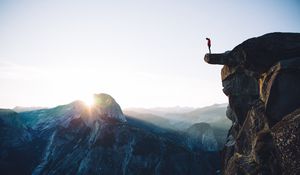 Preview wallpaper cliff, rock, man, mountains, height