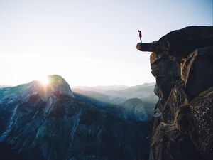 Preview wallpaper cliff, rock, man, mountains, height