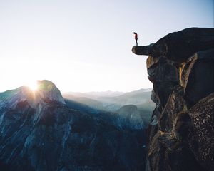 Preview wallpaper cliff, rock, man, mountains, height