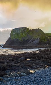 Preview wallpaper cliff, rocks, coast, sunset, sky