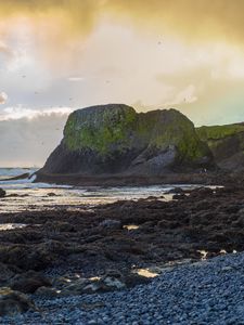 Preview wallpaper cliff, rocks, coast, sunset, sky