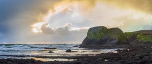 Preview wallpaper cliff, rocks, coast, sunset, sky