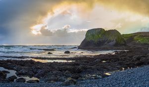 Preview wallpaper cliff, rocks, coast, sunset, sky