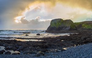 Preview wallpaper cliff, rocks, coast, sunset, sky