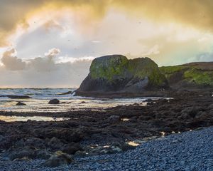 Preview wallpaper cliff, rocks, coast, sunset, sky