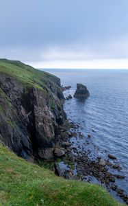 Preview wallpaper cliff, rocks, sea, horizon, stones