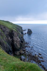 Preview wallpaper cliff, rocks, sea, horizon, stones