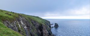 Preview wallpaper cliff, rocks, sea, horizon, stones