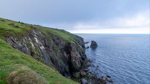 Preview wallpaper cliff, rocks, sea, horizon, stones