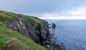 Preview wallpaper cliff, rocks, sea, horizon, stones