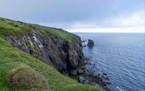 Preview wallpaper cliff, rocks, sea, horizon, stones