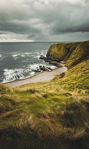 Preview wallpaper cliff, sea, coast, grass, beach, landscape