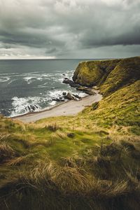 Preview wallpaper cliff, sea, coast, grass, beach, landscape