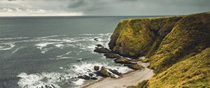 Preview wallpaper cliff, sea, coast, grass, beach, landscape