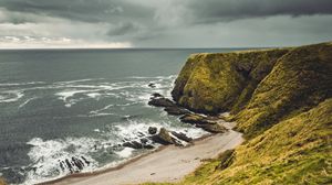 Preview wallpaper cliff, sea, coast, grass, beach, landscape