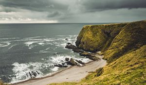 Preview wallpaper cliff, sea, coast, grass, beach, landscape