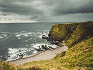 Preview wallpaper cliff, sea, coast, grass, beach, landscape