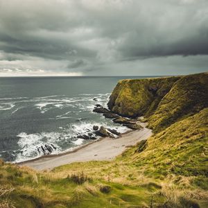 Preview wallpaper cliff, sea, coast, grass, beach, landscape