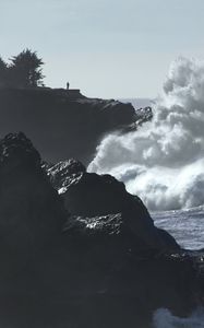 Preview wallpaper cliff, silhouette, alone, sea, waves, storm