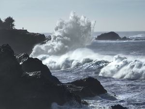 Preview wallpaper cliff, silhouette, alone, sea, waves, storm