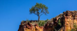 Preview wallpaper cliff, tree, relief, shadows, sky