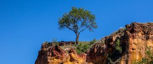 Preview wallpaper cliff, tree, relief, shadows, sky