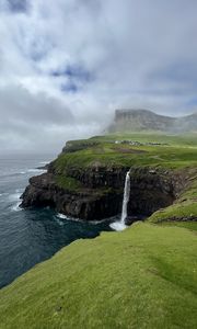 Preview wallpaper cliff, waterfall, sea, grass, fog