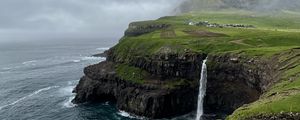 Preview wallpaper cliff, waterfall, sea, grass, fog