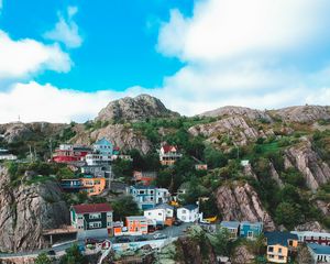 Preview wallpaper cliffs, buildings, coast, mountains, sea