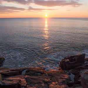 Preview wallpaper cliffs, coast, sea, sunset, glare