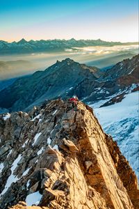 Preview wallpaper climber, traveler, rocks, snow, snowy