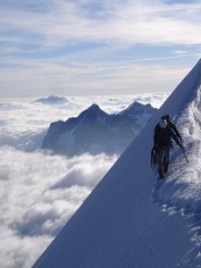 Preview wallpaper climbers, peak, top, conquest, traces, snow, clouds, vertical