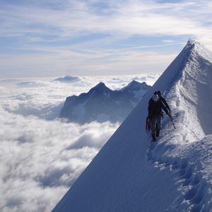 Preview wallpaper climbers, peak, top, conquest, traces, snow, clouds, vertical