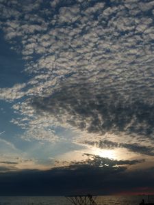 Preview wallpaper clouds, air, shadows, sea, evening, cloudy