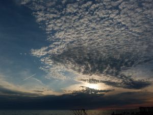 Preview wallpaper clouds, air, shadows, sea, evening, cloudy