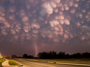 Preview wallpaper clouds, heavy, storm, lightning, bad weather, road, asphalt, lamps