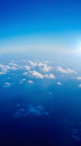 Preview wallpaper clouds, height, sky, sun, white, blue, light
