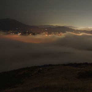 Preview wallpaper clouds, hills, fog, lights, evening